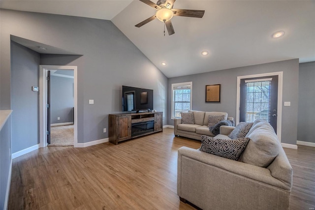 living room featuring baseboards, recessed lighting, light wood-style floors, high vaulted ceiling, and a ceiling fan