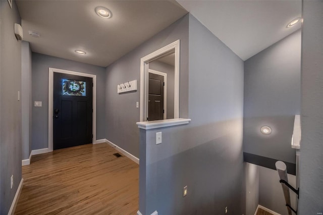 entrance foyer with visible vents, recessed lighting, wood finished floors, and baseboards