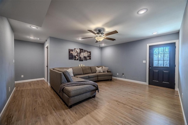 living room with a ceiling fan, recessed lighting, wood finished floors, and baseboards