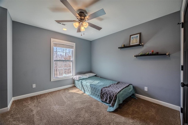 bedroom with carpet flooring, visible vents, baseboards, and ceiling fan