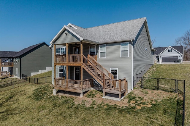 back of property featuring a fenced backyard, a wooden deck, and a yard