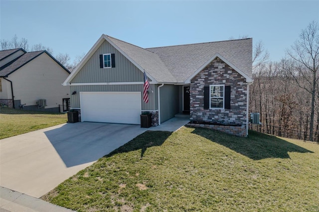 view of front of property with concrete driveway, central air condition unit, a front yard, and a shingled roof