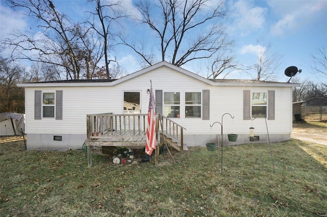 view of front of home featuring crawl space, a wooden deck, and a front yard