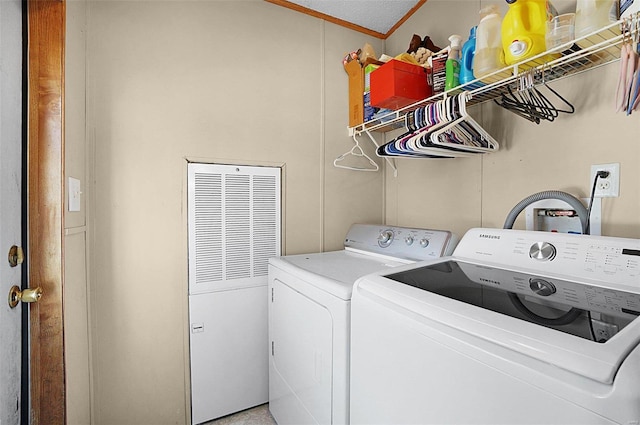 laundry room featuring washing machine and dryer and laundry area