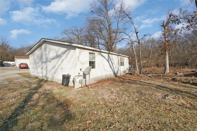 view of side of home featuring crawl space