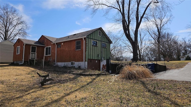 view of home's exterior with fence