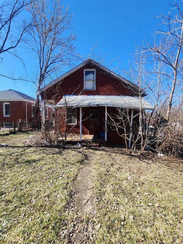 back of house with a porch