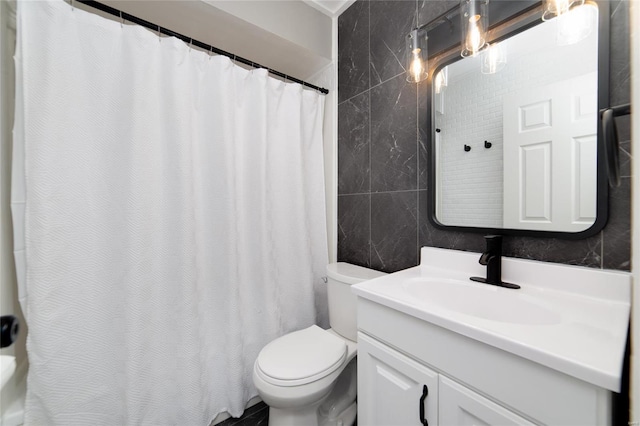 full bath with a shower with shower curtain, toilet, tile walls, and vanity