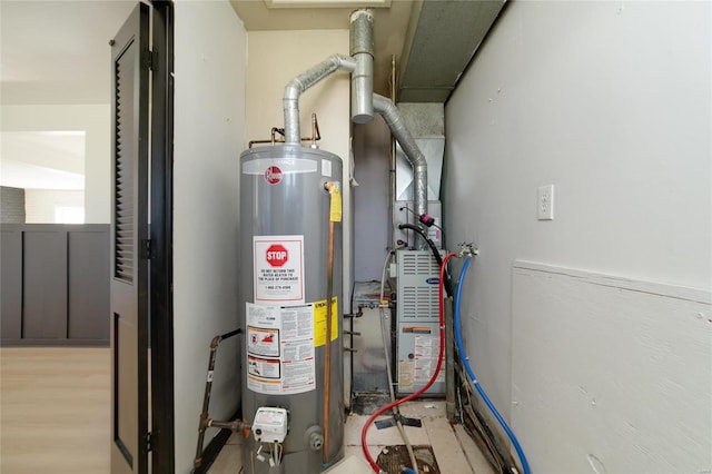 utility room with gas water heater