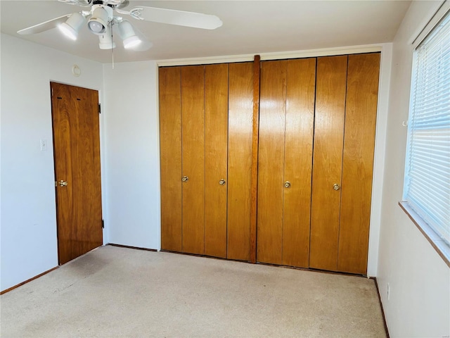 unfurnished bedroom featuring baseboards and a ceiling fan