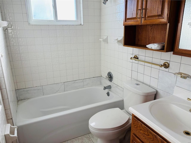 bathroom featuring toilet, tasteful backsplash, tile walls, bathing tub / shower combination, and vanity