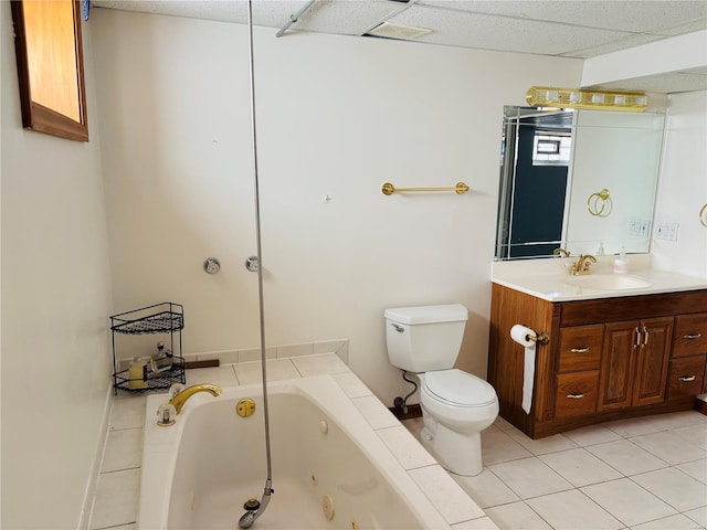 full bathroom with toilet, a drop ceiling, a tub with jets, tile patterned flooring, and vanity