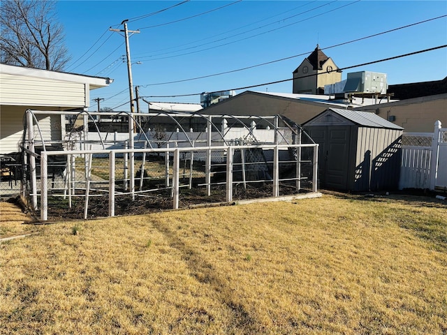 view of shed featuring cooling unit and fence