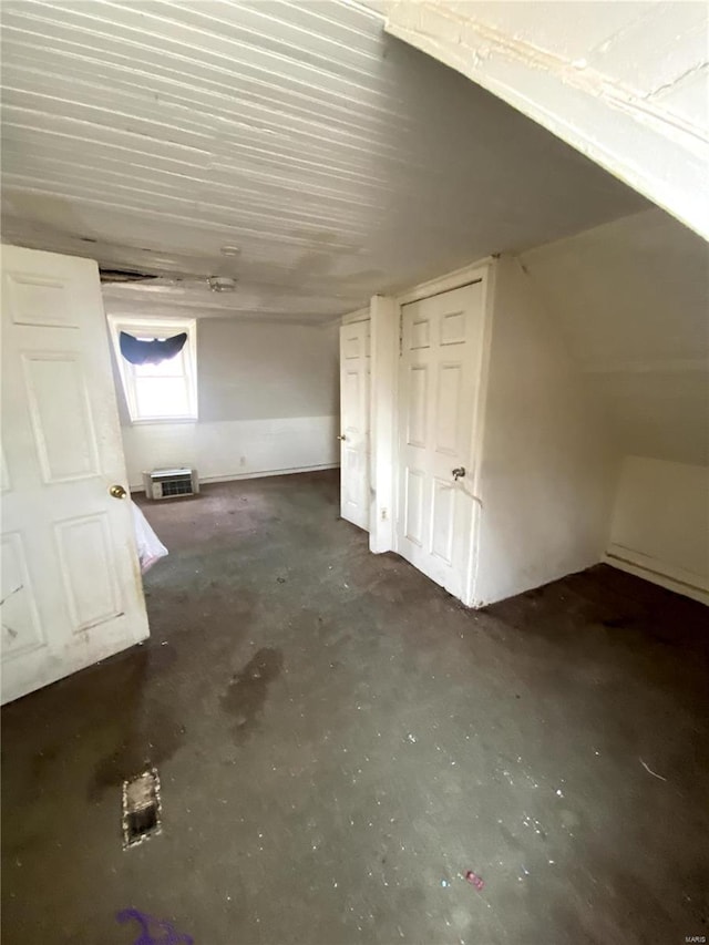 bonus room with concrete flooring