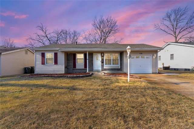 ranch-style house featuring a yard, covered porch, concrete driveway, an attached garage, and brick siding