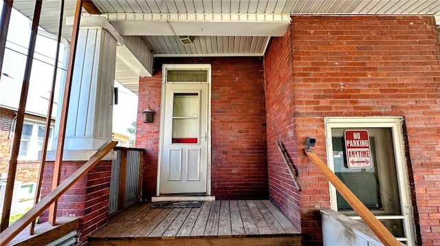 property entrance with brick siding