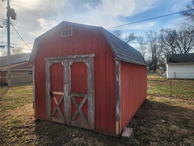 view of shed with fence