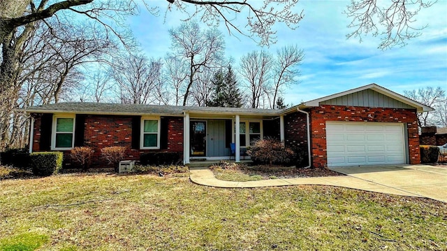 ranch-style home with driveway, brick siding, an attached garage, and a front yard