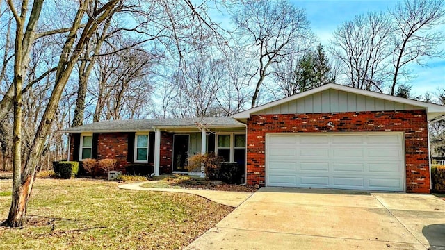 ranch-style home with a front lawn, driveway, board and batten siding, a garage, and brick siding