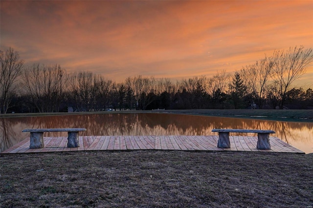 yard at dusk with a water view