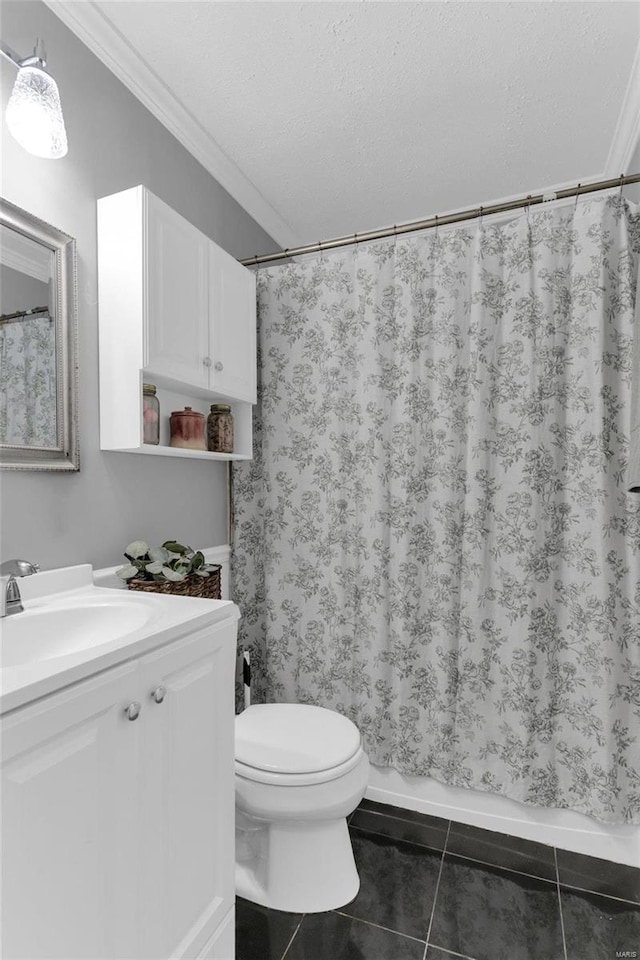 full bath with toilet, vanity, ornamental molding, tile patterned floors, and a textured ceiling