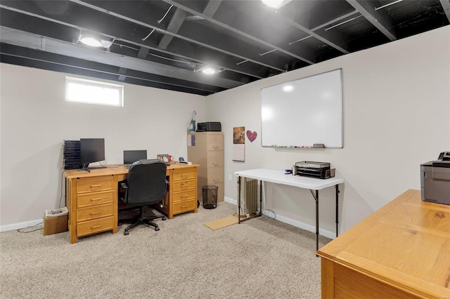 office area with light colored carpet and baseboards