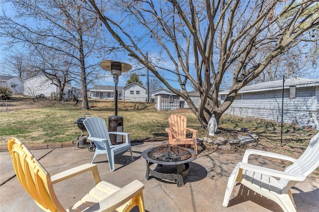 view of patio / terrace with fence and an outdoor fire pit