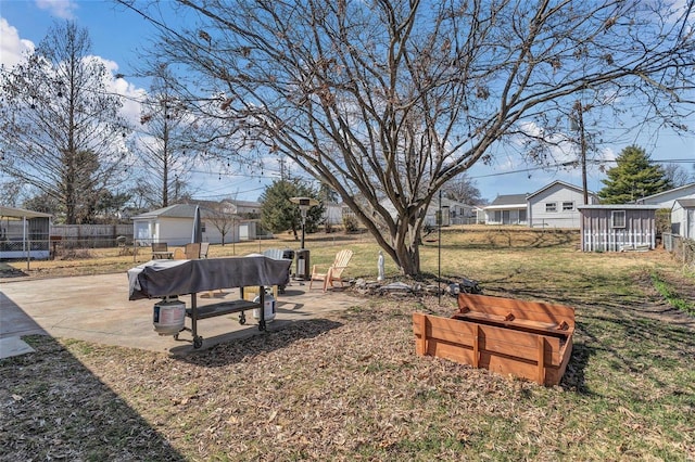 view of yard featuring an outdoor structure and fence