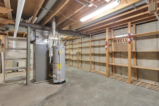 unfinished basement featuring gas water heater