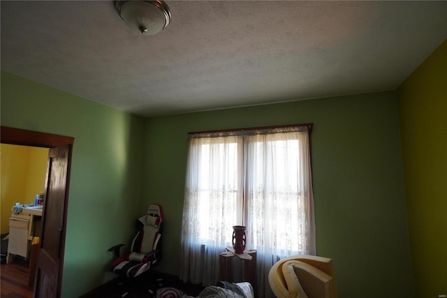 interior space featuring a textured ceiling