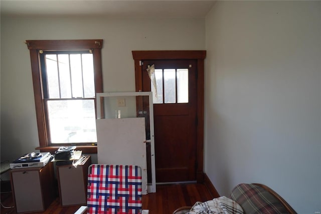 bedroom featuring wood finished floors and baseboards