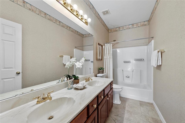 bathroom with a sink, visible vents, shower / bath combo with shower curtain, and toilet