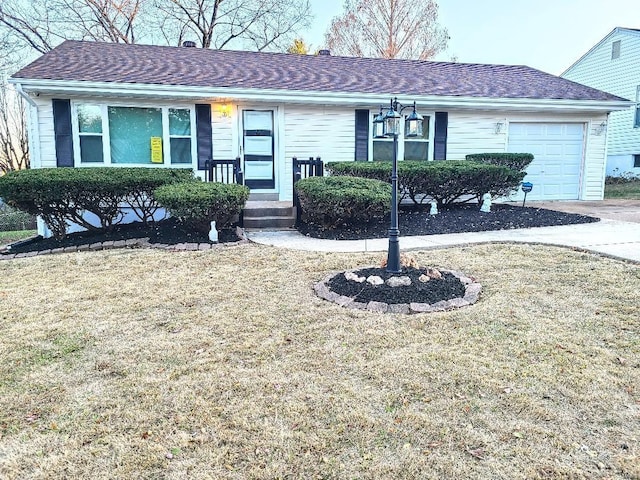 ranch-style home with an attached garage, a shingled roof, and a front lawn