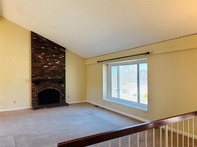 unfurnished living room featuring visible vents, baseboards, carpet, and vaulted ceiling