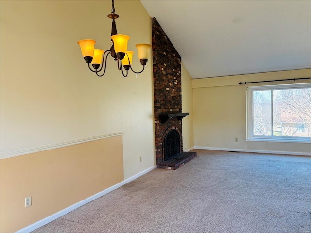 unfurnished living room with an inviting chandelier, a brick fireplace, carpet flooring, and baseboards