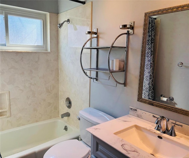 bathroom with vanity, toilet, and shower / bathtub combination