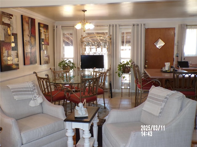 tiled living room featuring a notable chandelier and ornamental molding