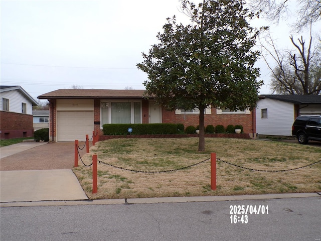 single story home with brick siding, a garage, driveway, and a front yard