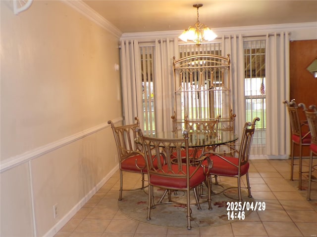 dining area with a healthy amount of sunlight, crown molding, tile patterned flooring, and a chandelier