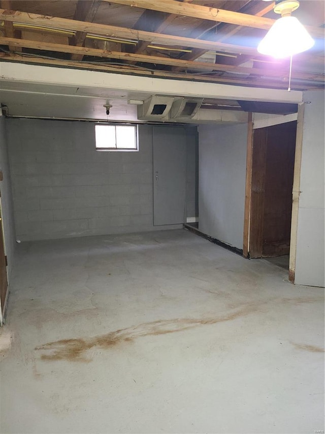 basement featuring concrete block wall