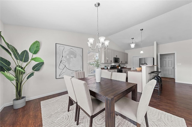 dining space featuring a notable chandelier, baseboards, lofted ceiling, and dark wood-style flooring