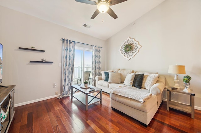 living area with visible vents, ceiling fan, baseboards, lofted ceiling, and hardwood / wood-style floors