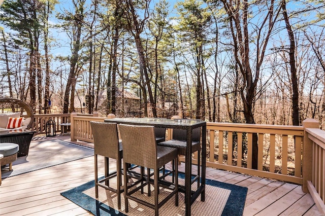 wooden deck featuring outdoor dining space