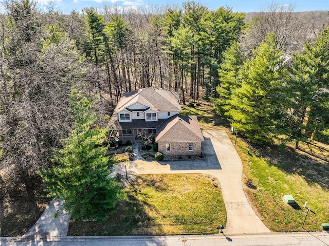 aerial view featuring a wooded view