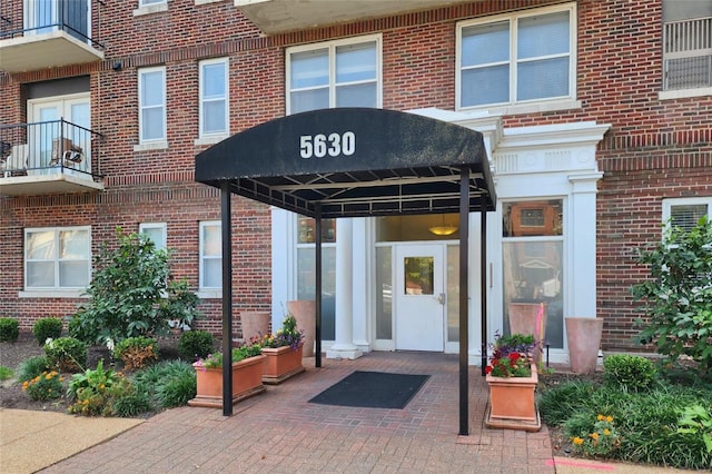 entrance to property with brick siding