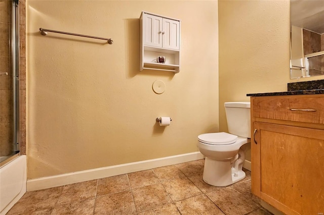 bathroom with shower / bath combination with glass door, baseboards, toilet, and vanity