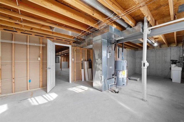 unfinished basement featuring heating unit and water heater