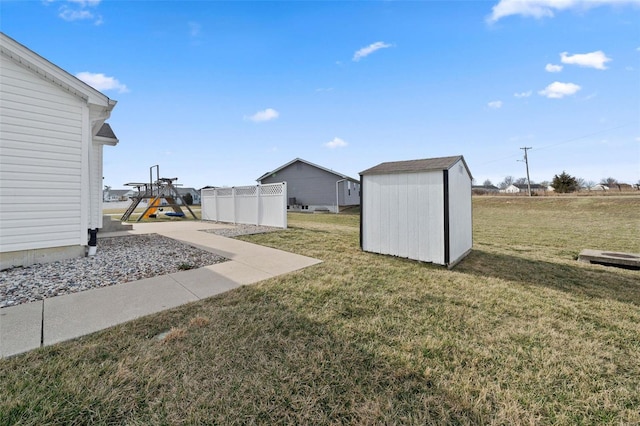 view of yard featuring a storage shed and an outbuilding