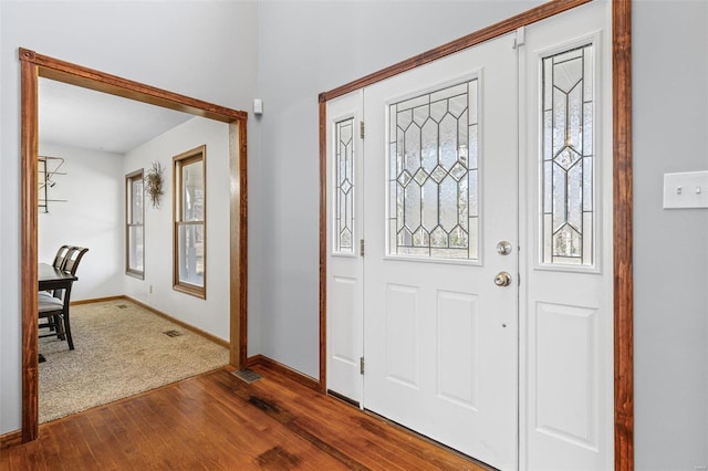 entrance foyer with visible vents, baseboards, and dark wood-style flooring