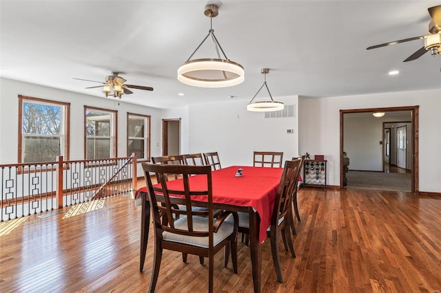 dining room featuring recessed lighting, visible vents, baseboards, and wood finished floors